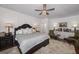 Comfortable main bedroom features a ceiling fan and patterned area rug at 3320 Lost Valley Dr, Jonesboro, GA 30236