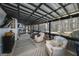 Relaxing screened porch with comfortable seating, a ceiling fan, and views of the backyard and pool at 3320 Lost Valley Dr, Jonesboro, GA 30236