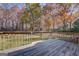 Inviting wooden deck overlooking a spacious backyard with lush trees and a shed at 106 Kirkland Rd, Covington, GA 30016