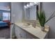 Bright bathroom featuring a decorative vanity, framed mirror, and neutral décor at 106 Kirkland Rd, Covington, GA 30016
