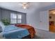 This is a picture of a bedroom with neutral paint and carpet, ceiling fan and a view to office at 106 Kirkland Rd, Covington, GA 30016