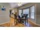 Open breakfast nook with natural lighting, a glass table and direct kitchen access at 106 Kirkland Rd, Covington, GA 30016