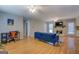 Spacious living room featuring hardwood floors, a stone fireplace, and neutral walls, open layout at 106 Kirkland Rd, Covington, GA 30016