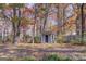 Backyard shed surrounded by trees, providing extra storage space for tools or equipment at 106 Kirkland Rd, Covington, GA 30016