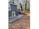Large backyard with concrete patio and deck at 851 Bridgewater Ct, Stone Mountain, GA 30088
