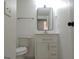 Bathroom with a modern rectangular mirror and white vanity with drawers at 851 Bridgewater Ct, Stone Mountain, GA 30088