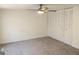 Bedroom featuring a ceiling fan, and sliding door closet doors at 851 Bridgewater Ct, Stone Mountain, GA 30088