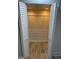 Large walk-in closet with built-in wire shelving and wood-look tile at 851 Bridgewater Ct, Stone Mountain, GA 30088