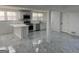 This bright open-concept kitchen has stainless steel appliances and a peninsula island at 851 Bridgewater Ct, Stone Mountain, GA 30088