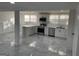 This bright open-concept kitchen has stainless steel appliances and an island at 851 Bridgewater Ct, Stone Mountain, GA 30088