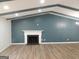 Spacious living room with a white mantle fireplace and wooden beam ceiling at 851 Bridgewater Ct, Stone Mountain, GA 30088