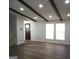Open living room features wood flooring, recessed lighting and a wooden beamed ceiling at 851 Bridgewater Ct, Stone Mountain, GA 30088