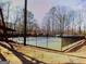 Well maintained community tennis court surrounded by mature trees and fencing for recreational play at 851 Bridgewater Ct, Stone Mountain, GA 30088