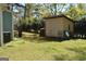 Spacious backyard with shed offering ample storage or workshop space at 121 Juniper Dr, Mcdonough, GA 30253