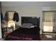 Bright bedroom with ample natural light, wood furniture, and plenty of room to relax at 121 Juniper Dr, Mcdonough, GA 30253