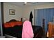 Bright bedroom featuring natural light from a large window and wood furniture at 121 Juniper Dr, Mcdonough, GA 30253