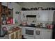 Functional kitchen with white appliances, ample counter space, and white cabinets offering storage solutions at 121 Juniper Dr, Mcdonough, GA 30253