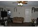 Cozy living room with a comfortable sofa, neutral walls, and entertainment center, perfect for relaxing at 121 Juniper Dr, Mcdonough, GA 30253