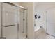 Functional bathroom with a shower featuring sliding glass doors and a separate tub at 2733 Newtons Crest Cir, Snellville, GA 30078