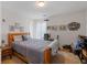 Neutral bedroom with a classic wood bed frame, side table and ample space at 2733 Newtons Crest Cir, Snellville, GA 30078