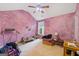 Eclectic bedroom with unique purple walls, a window, and a ceiling fan at 2733 Newtons Crest Cir, Snellville, GA 30078