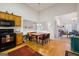 Eat-in kitchen with wood cabinets, stainless appliances, and adjacent dining area with ample seating at 2733 Newtons Crest Cir, Snellville, GA 30078