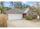 Charming single-Gathering home with a two-car garage, well-manicured lawn, and inviting curb appeal at 2733 Newtons Crest Cir, Snellville, GA 30078