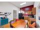 Bright kitchen and dining area featuring modern appliances, a vibrant accent wall, and ample natural light at 2733 Newtons Crest Cir, Snellville, GA 30078