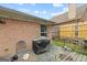Cozy patio area with outdoor seating and a covered grill, perfect for enjoying outdoor meals and entertaining guests at 2733 Newtons Crest Cir, Snellville, GA 30078