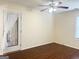 Cozy bedroom featuring a ceiling fan, natural light and access to the backyard at 6544 Bussell Way, Riverdale, GA 30274