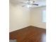 Bedroom with hardwood floors, natural light from a window, and neutral paint at 6544 Bussell Way, Riverdale, GA 30274