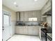 Well-maintained kitchen with tile flooring, stainless steel appliances and backyard access at 6544 Bussell Way, Riverdale, GA 30274