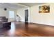 Bright living room with gleaming hardwood floors, natural light, and neutral color palette at 6544 Bussell Way, Riverdale, GA 30274