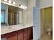 Bright bathroom with double sinks, wood cabinets, and toilet with neutral paint at 461 Best Friends Turn Aly, Mcdonough, GA 30252