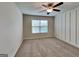 Bright bedroom with a modern ceiling fan and wainscoting, complemented by soft natural light at 461 Best Friends Turn Aly, Mcdonough, GA 30252