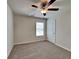 Cozy carpeted bedroom with a ceiling fan and a window, offering a comfortable retreat at 461 Best Friends Turn Aly, Mcdonough, GA 30252