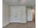 Neutral bedroom showcasing wainscoting, a closet, and soft carpet, offering comfort and style at 461 Best Friends Turn Aly, Mcdonough, GA 30252