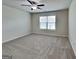 Spacious carpeted bedroom with a ceiling fan and a window providing natural light at 461 Best Friends Turn Aly, Mcdonough, GA 30252