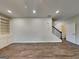 Spacious living room with built-in shelving and wood-look flooring at 461 Best Friends Turn Aly, Mcdonough, GA 30252