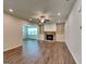 Open living space with fireplace, built-in shelving, and hardwood floors at 461 Best Friends Turn Aly, Mcdonough, GA 30252