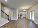 Open-concept layout seamlessly connects the living area to the kitchen and dining space at 461 Best Friends Turn Aly, Mcdonough, GA 30252