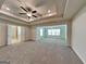 Expansive main bedroom with trey ceiling and access to en-suite bathroom at 461 Best Friends Turn Aly, Mcdonough, GA 30252