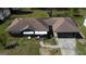 Aerial view of a single story brick house and carport showing the roof at 4487 Berkshire Rd, Forest Park, GA 30297