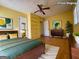 Staged bedroom with bed, dresser, and a view from the window at 4487 Berkshire Rd, Forest Park, GA 30297