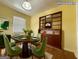 Staged dining room with hardwood floors, neutral walls, and ample natural light at 4487 Berkshire Rd, Forest Park, GA 30297