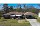 Charming brick home with carport and landscaped yard, perfect for outdoor living at 4487 Berkshire Rd, Forest Park, GA 30297
