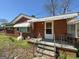 Charming brick home with landscaped yard and awning, offering a warm welcome at 4487 Berkshire Rd, Forest Park, GA 30297