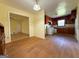Traditional kitchen with wood cabinets, laminate floors, and white appliances at 4487 Berkshire Rd, Forest Park, GA 30297