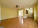 Spacious living room featuring hardwood floors, neutral walls, and ample natural light at 4487 Berkshire Rd, Forest Park, GA 30297