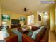 Staged living room featuring hardwood floors, neutral walls, and ample natural light at 4487 Berkshire Rd, Forest Park, GA 30297
